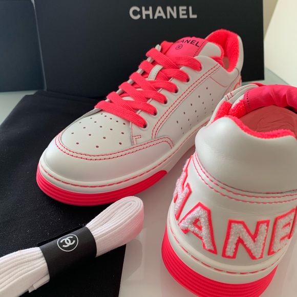 white and pink trainers